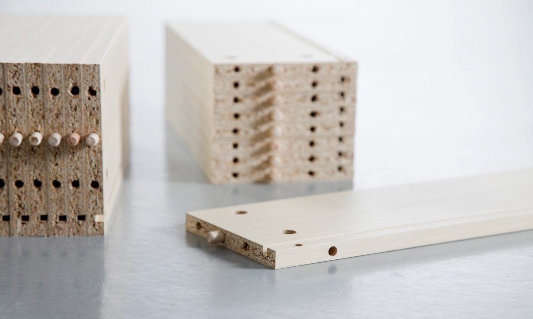 Furniture panels with drilled holes and inserted dowels
